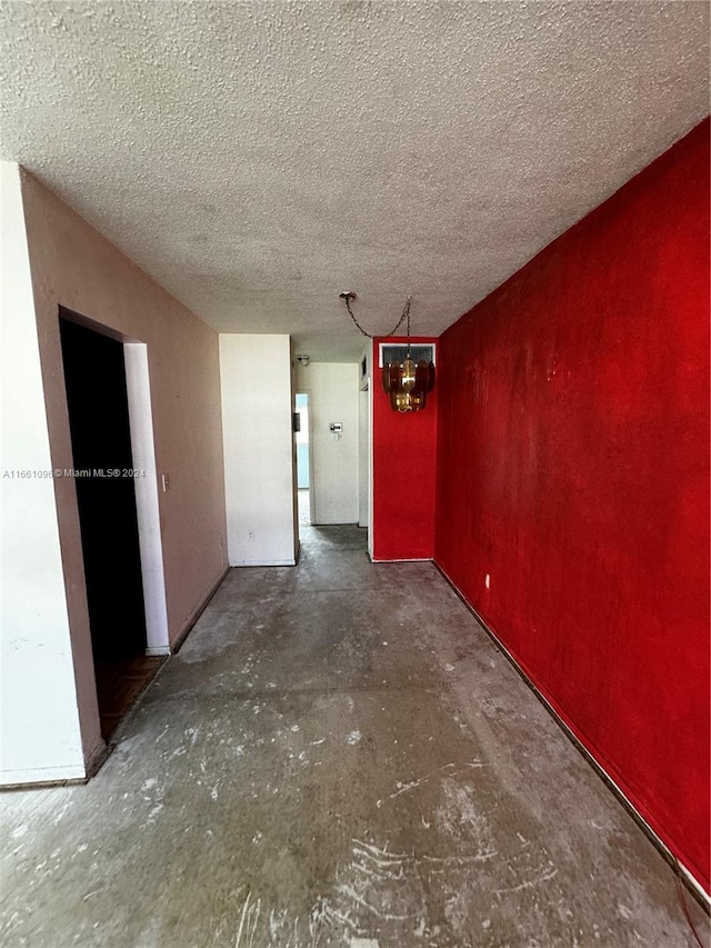 spare room featuring a textured ceiling