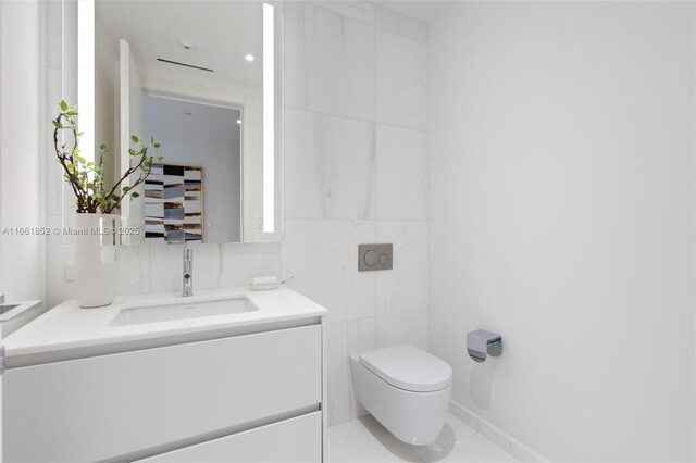 bedroom featuring access to exterior, a wall of windows, and a water view