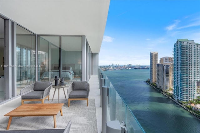 balcony featuring a water view