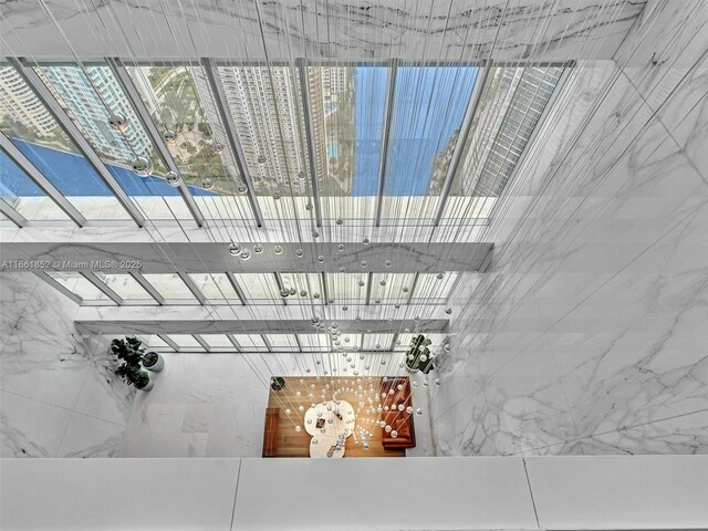 interior space featuring a water view and light hardwood / wood-style flooring