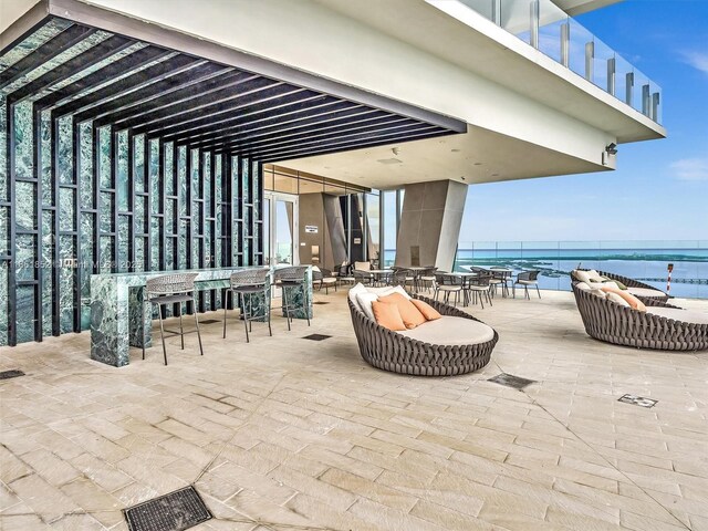 view of swimming pool featuring a water view