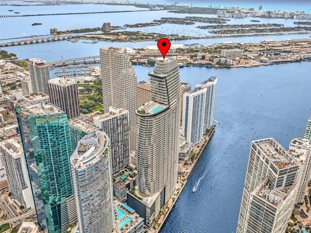 birds eye view of property with a water view