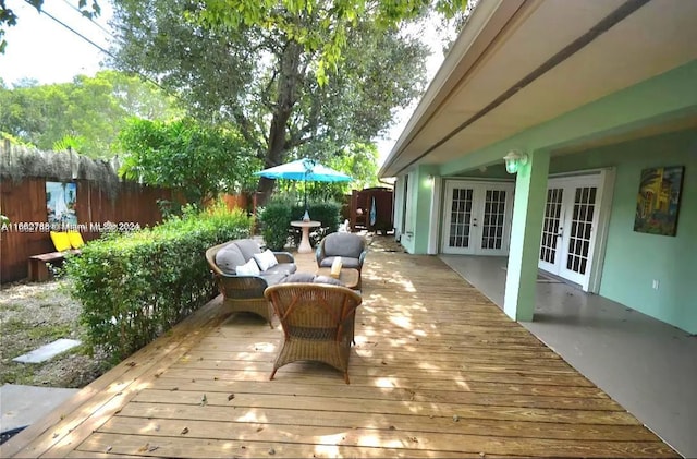 wooden deck featuring french doors