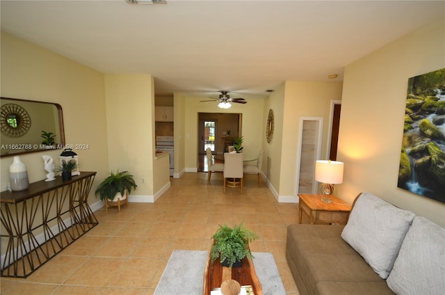 living room featuring light tile patterned flooring and ceiling fan