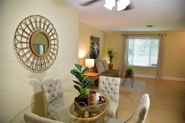 dining area featuring light tile patterned floors and ceiling fan