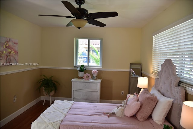 bedroom with dark wood-type flooring and ceiling fan