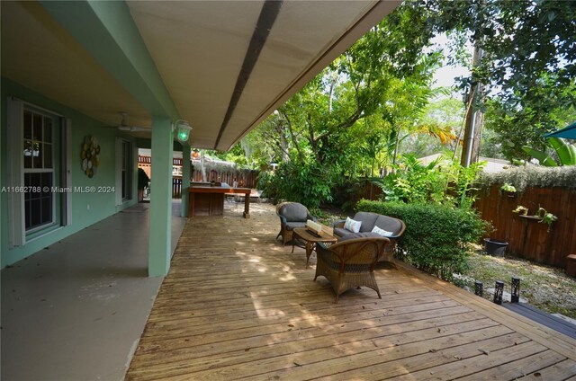 wooden deck with ceiling fan