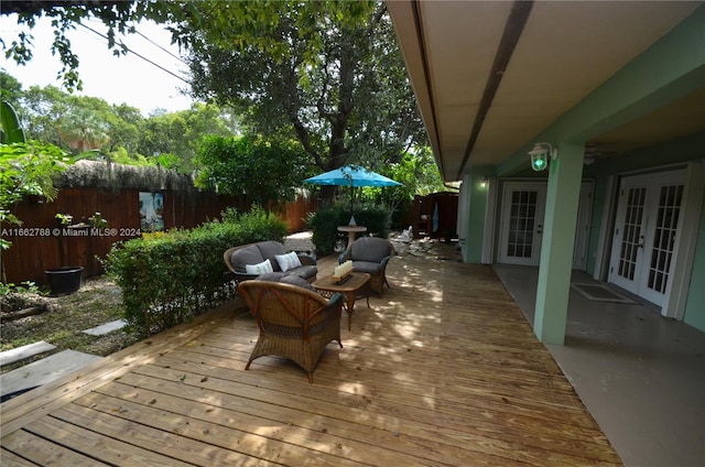 wooden terrace with outdoor lounge area