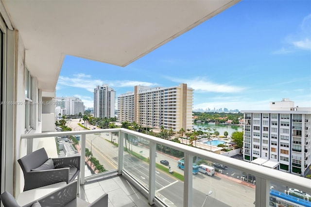 balcony featuring a water view