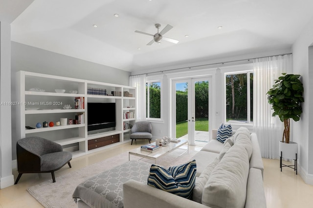 living room featuring ceiling fan and french doors