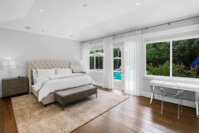 bedroom featuring access to exterior, baseboards, hardwood / wood-style floors, and recessed lighting