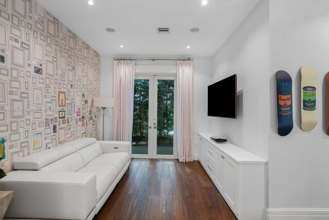 living room with dark wood-type flooring and french doors