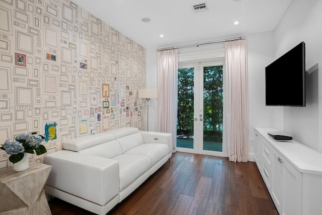 living room featuring french doors and dark hardwood / wood-style flooring