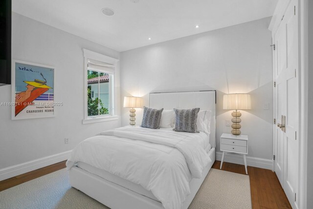 bedroom with hardwood / wood-style flooring