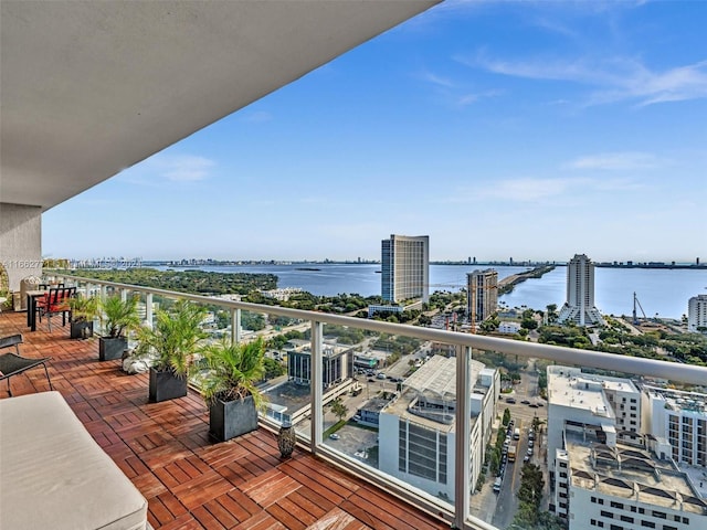 balcony featuring a water view