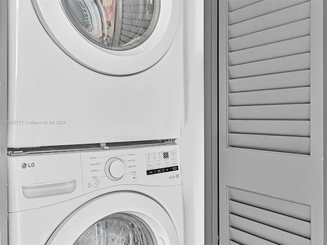 laundry area with stacked washer and dryer