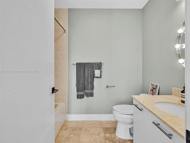 full bathroom with tiled shower / bath combo, vanity, toilet, and tile patterned floors