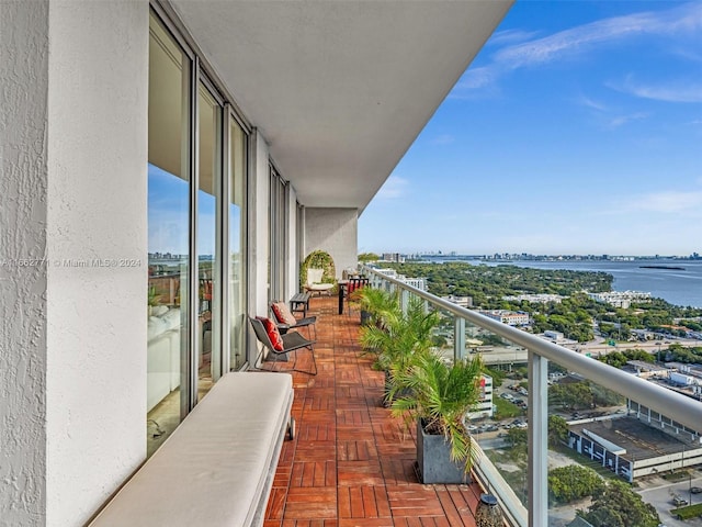 balcony featuring a water view