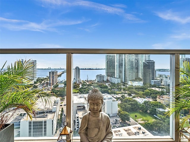 balcony featuring a water view