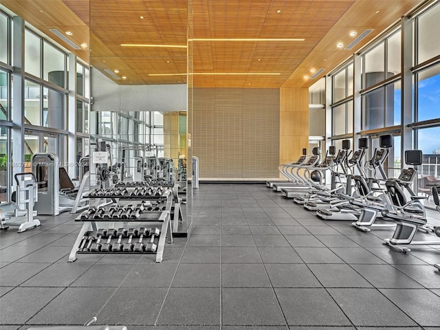 exercise room with floor to ceiling windows and plenty of natural light