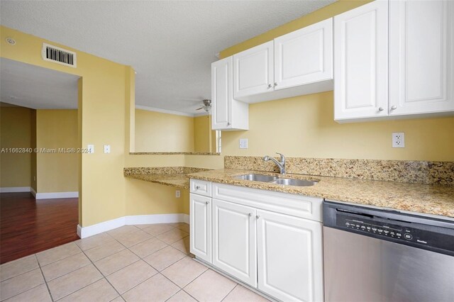 kitchen with white cabinetry, dishwasher, and sink