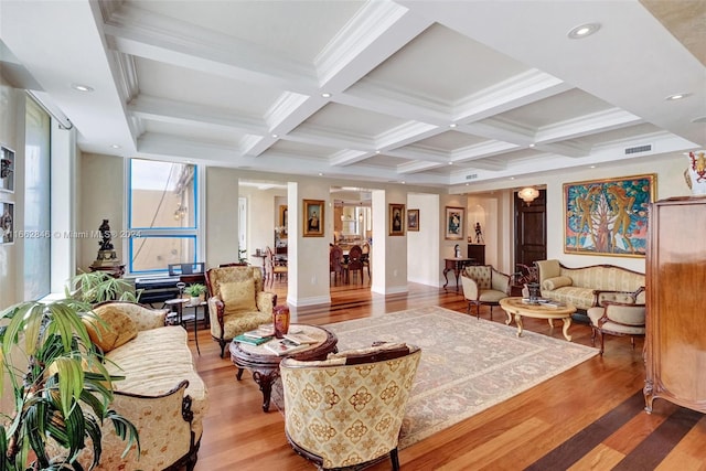 living room with light wood-type flooring, beamed ceiling, coffered ceiling, and crown molding