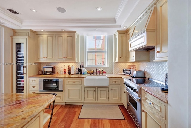 9801 NW Collins Ave Unit Ph8, Bal Harbour, FL 33154 - kitchen with a sink, a raised ceiling, visible vents, and gas range