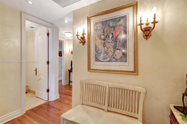 corridor with light hardwood / wood-style flooring