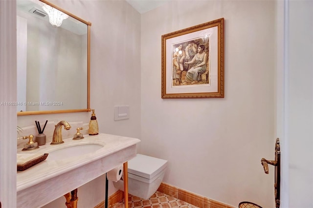 9801 NW Collins Ave Unit Ph8, Bal Harbour, FL 33154 - half bath with baseboards, toilet, and visible vents