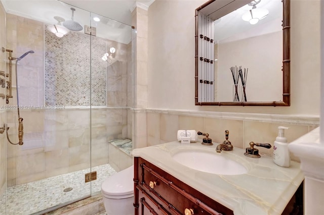 bathroom featuring vanity, toilet, and an enclosed shower