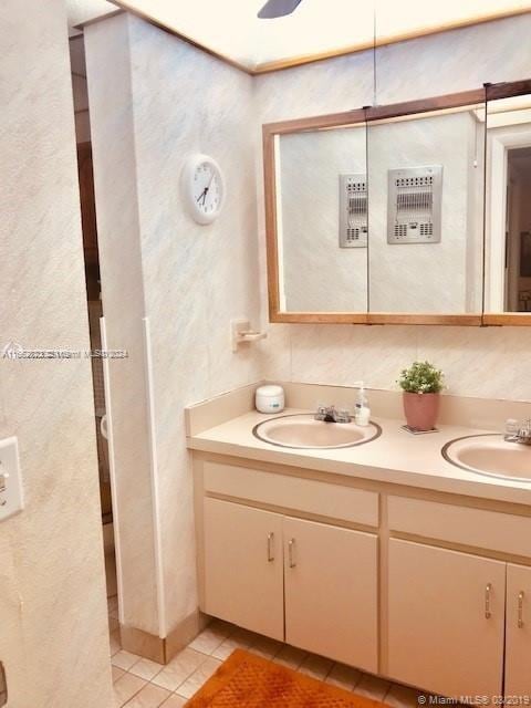 bathroom with tile patterned flooring and vanity