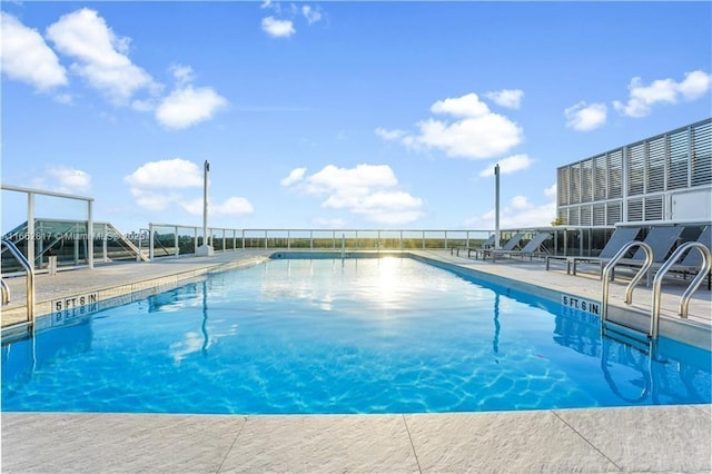 view of pool featuring a patio