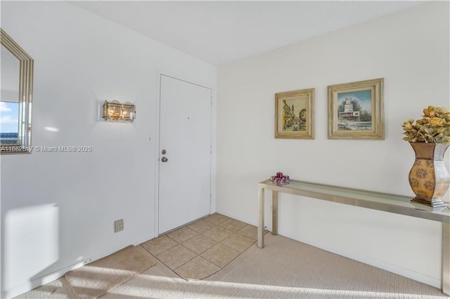 entryway featuring light tile patterned flooring