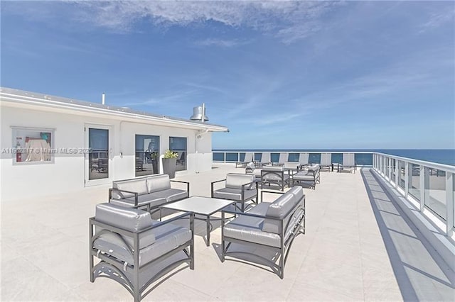 view of patio with a water view