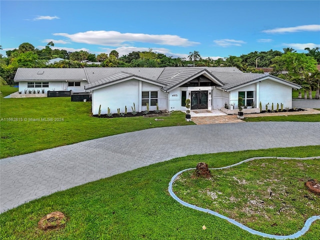 single story home with a front yard