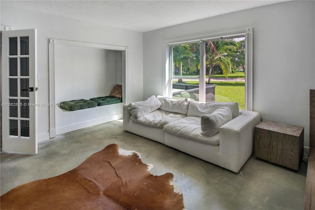 living room featuring a textured ceiling