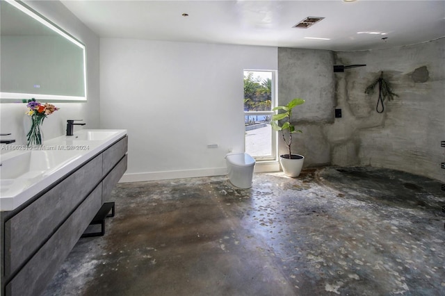 bathroom featuring vanity, a shower, toilet, and concrete floors