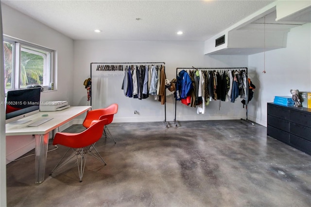 home office with a textured ceiling