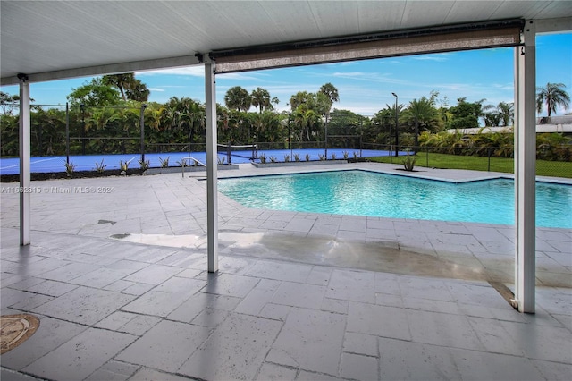 view of swimming pool featuring a patio area