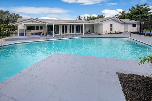 view of pool featuring a patio