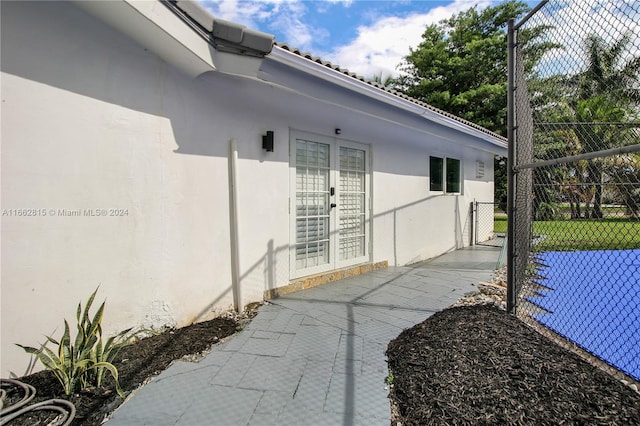 view of property exterior featuring french doors