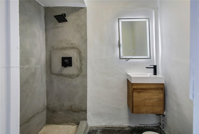 bathroom with vanity and a shower