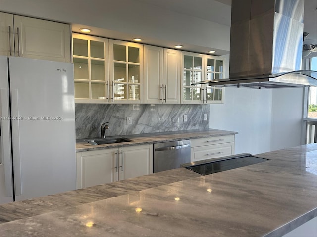 kitchen with tasteful backsplash, white refrigerator, island range hood, dishwasher, and sink