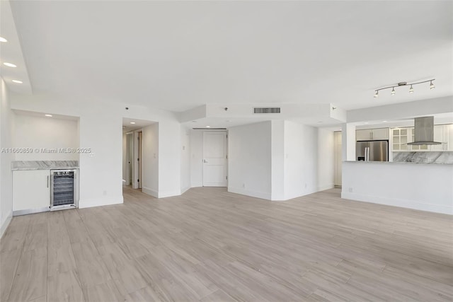 view of patio featuring a city view, exterior kitchen, a balcony, and ceiling fan