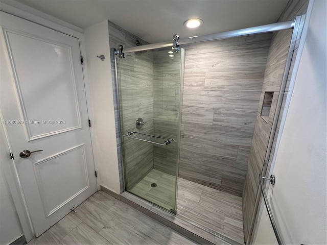 bathroom featuring an enclosed shower