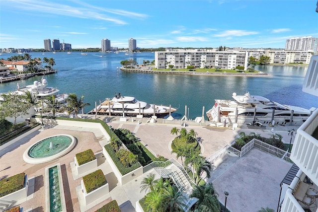 view of water feature with a city view and a dock