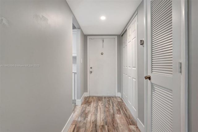 corridor featuring light hardwood / wood-style floors