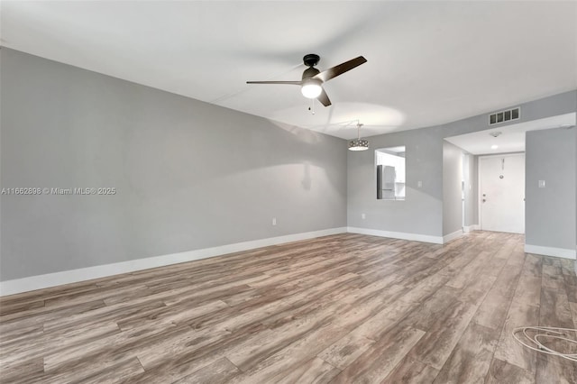 unfurnished room featuring ceiling fan and light hardwood / wood-style flooring
