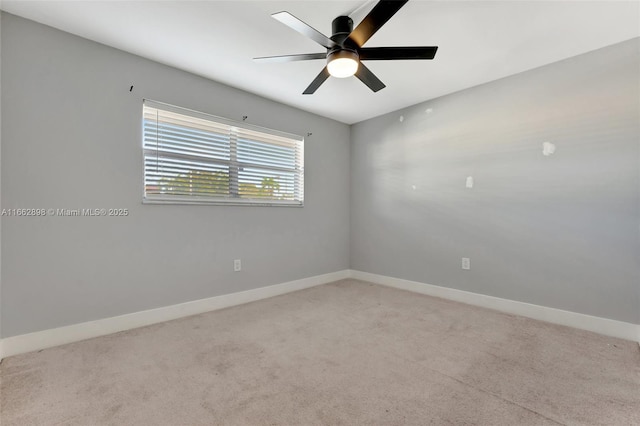 empty room featuring light colored carpet and ceiling fan