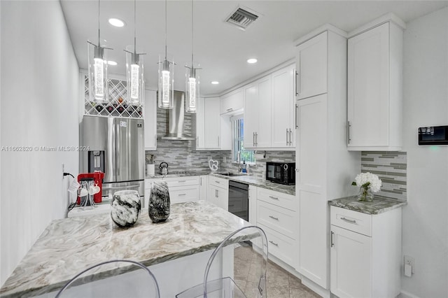 kitchen with black appliances, white cabinetry, and light stone counters